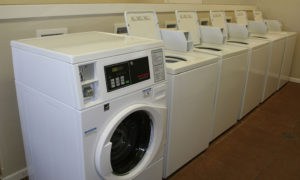 Laundry room with new washers and dryers at our Lawrence apartments.
